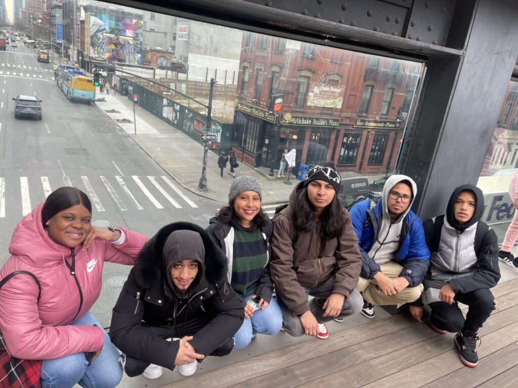 group photo of students crouching down