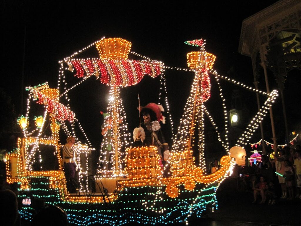 Pirate ship float lit with hundreds of lights at night
