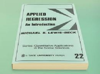 The book Applied Regression: An Introduction by Michael S. Lewis-Beck, part of the Quantitative Applications in the Social Sciences series, lying on a flat surface.