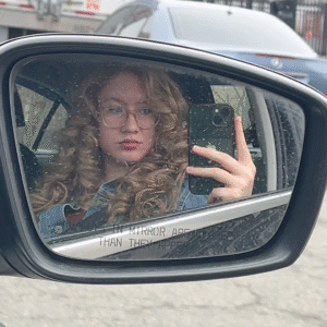 photo of me in the passenger seat of my car