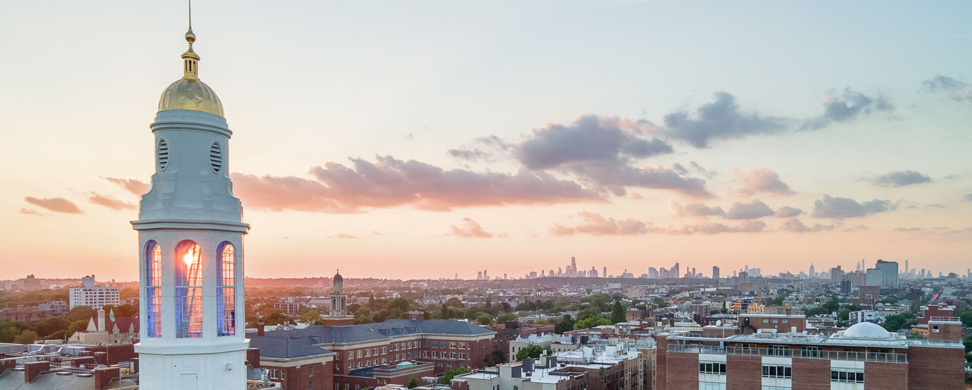 Brooklyn College clock tower and skyline, low sun