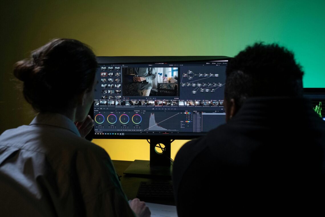 two editors at a computer