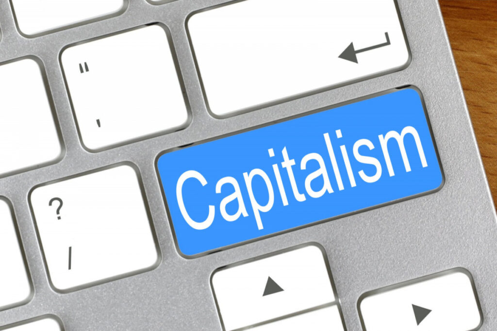 picture of a a computer keyboard with a "Capitalism" key on it