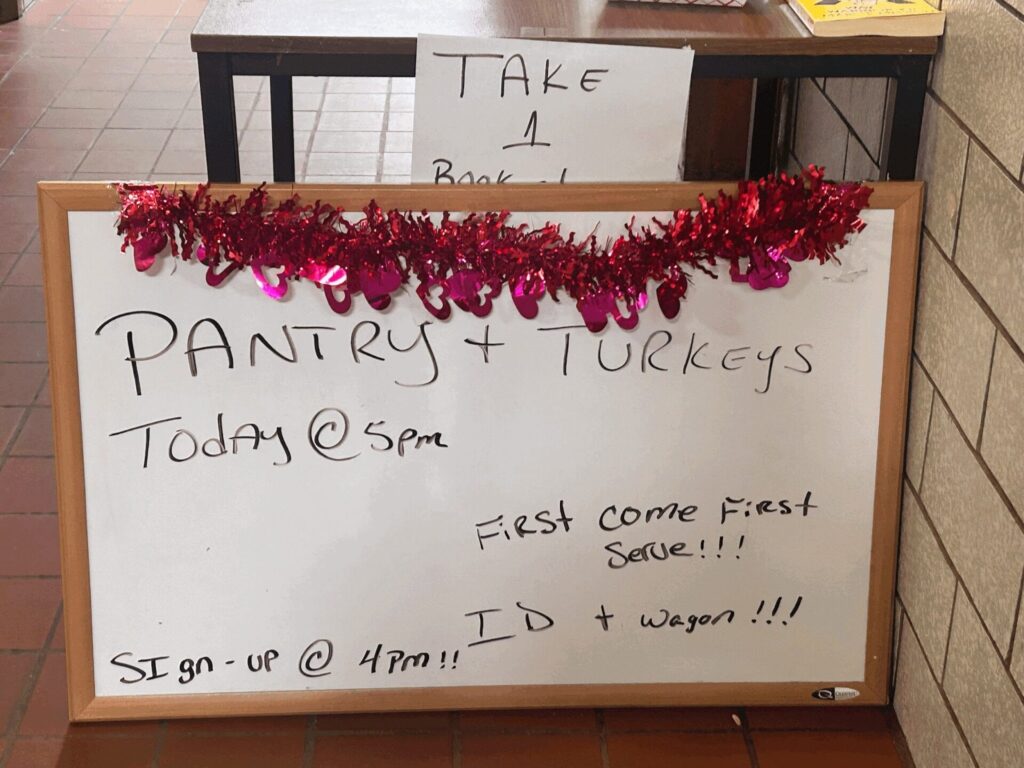 A sign outside the Grant Food Pantry provides information for residents. 