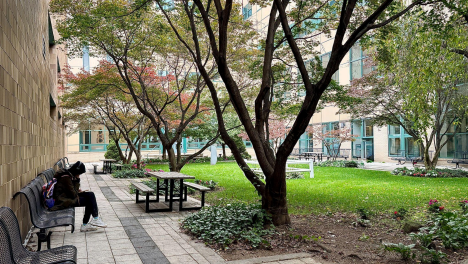 A student sits outside the E-Atrium at LaGuardia Community College. (Photo credit: Mahdi Tanim)