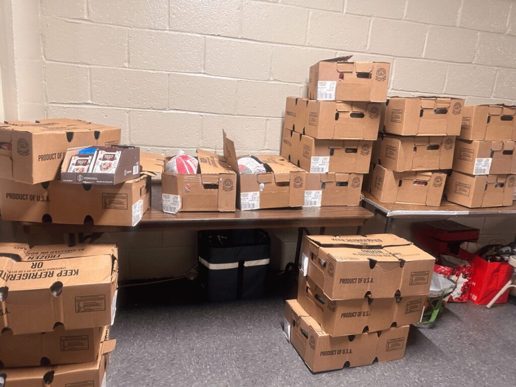 Boxes of donated turkeys sit ready for distribution to residents at Grant Houses.