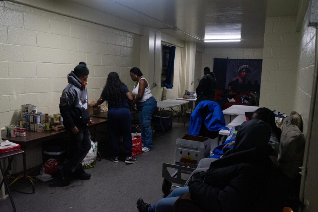 Chebella Hayward and her team sort and prepare food for distribution at Grant Houses.