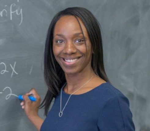 Anisha Clark at a chalkboard