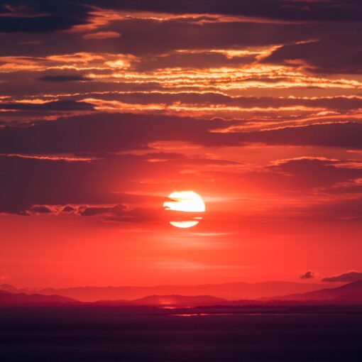 A blood red sunset. Photo by Jason Blackeye at Unsplash.