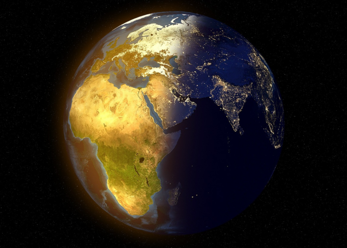 Earth viewed from space, with Africa lit up in the sun.