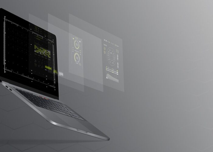 A laptop floating in grey space projects its screen in several layers into the air.
