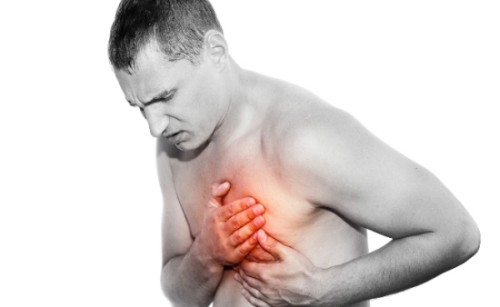 Man holding chest because of aortic rupture