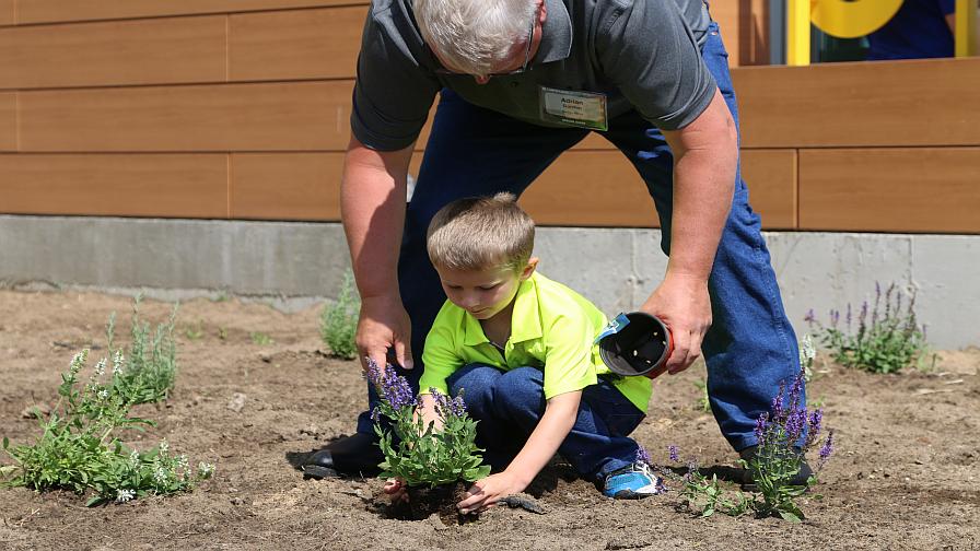 Father son planting WinField Crop Adventure