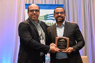 Topcon Agriculture’s Bruno Lucio (right), Director of Sales, Latin America, receives the AgGateway in Action Latin America Region Award from AgGateway Regional Director Jose Loyola.