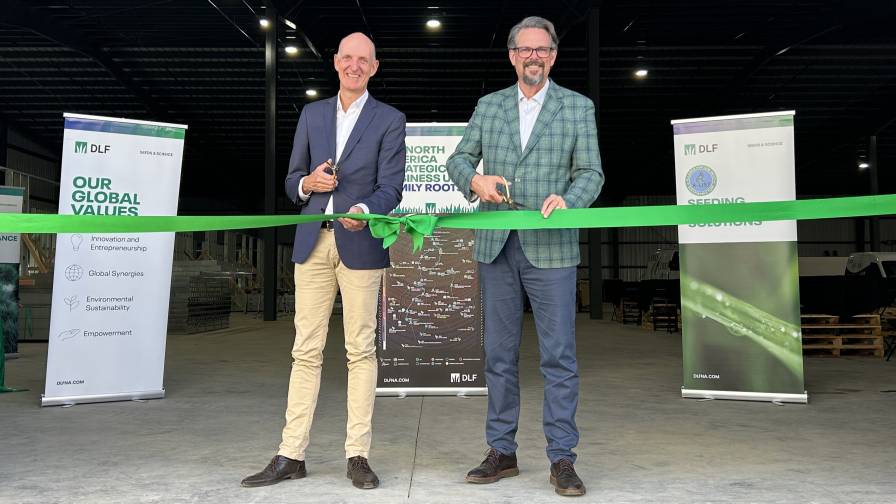DLF's Soren Halbye and Neil Douglas Cutting Ribbon at New Facility
