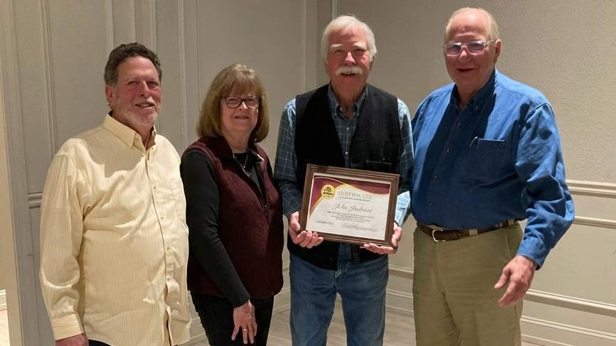 (from left) ASAC Board Member and Past President Bill Zweigbaum, Sharon Jackson, award recipient John Jackson (holding the Certificate of Lifetime Membership), and Past President Pete Weisenberger. The award was personally presented at a special recognition dinner in Hays, Kan., in December following the 62nd ASAC Annual Meeting and Conference.