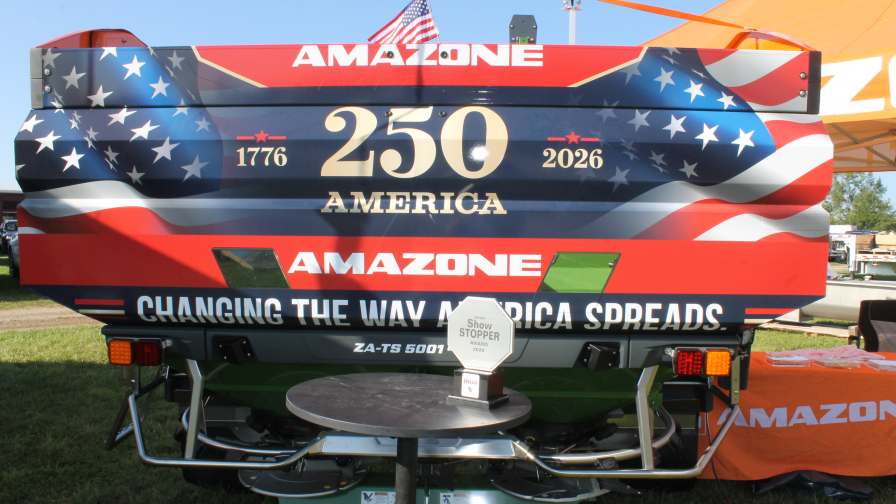 The Amazone ZA-TS 01 AutoSpread unit, shown with the 2026 CropLife IRON ShowStopper Award trophy sitting in the foreground.