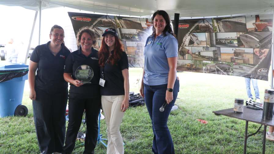 The team from New Leader accepts the 2026 MAGIE Image Award from Illinois Fertilizer & Chemical Association CEO and President Jenny Webb, right.