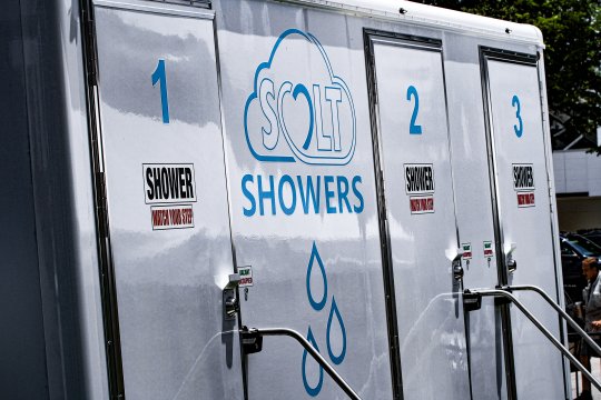 Volunteer Homebase Banner for SALT Outreach with hands together in the background