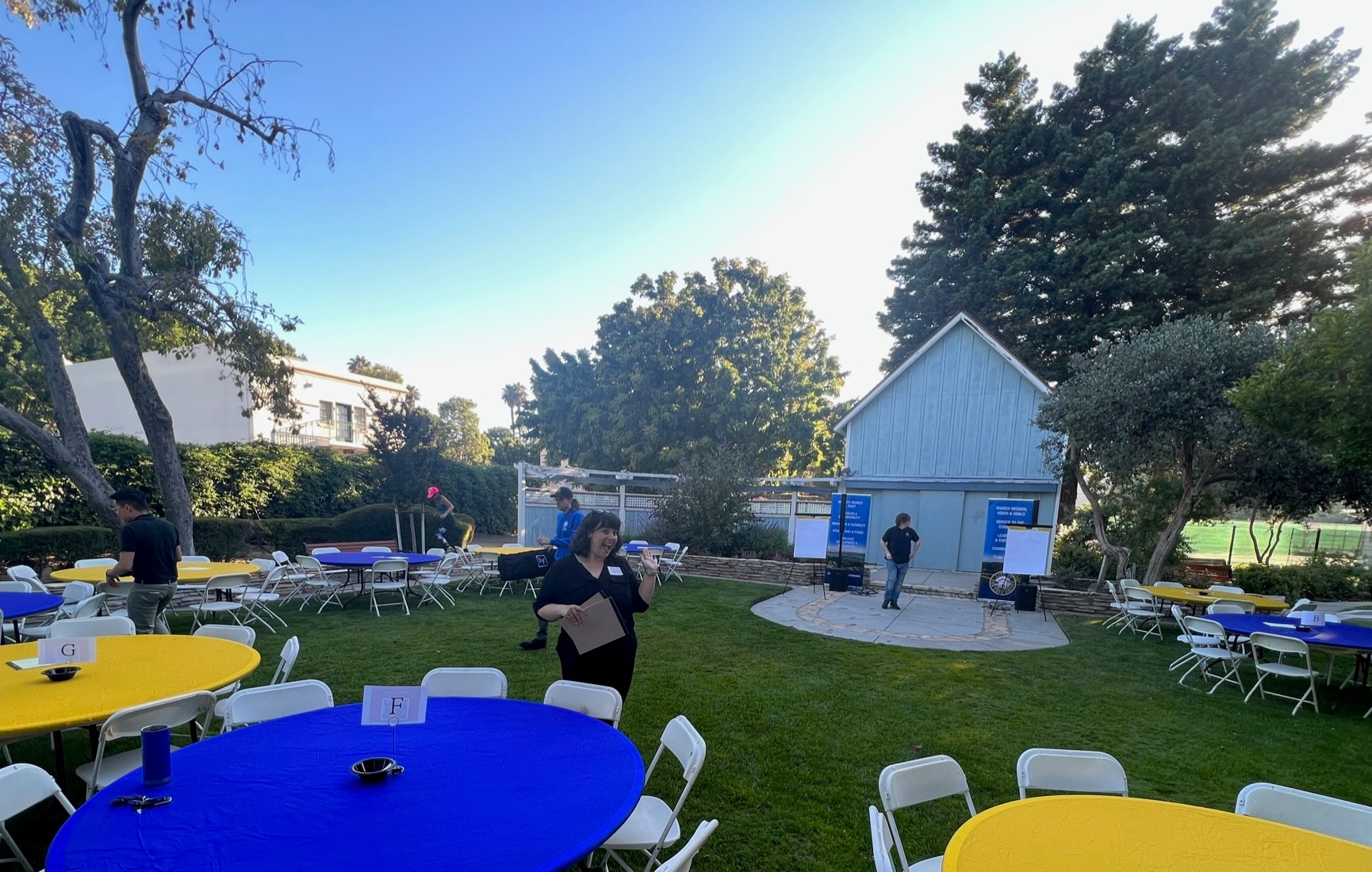 Volunteers help set up for an event at the Jack House