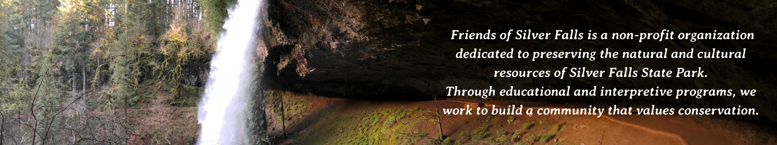 View of North Falls with trail going behind the waterfall.
