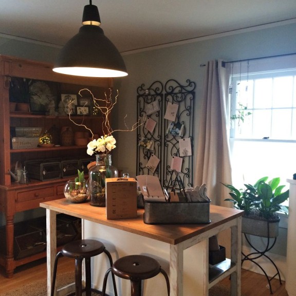The garden-themed craft room includes many store products.