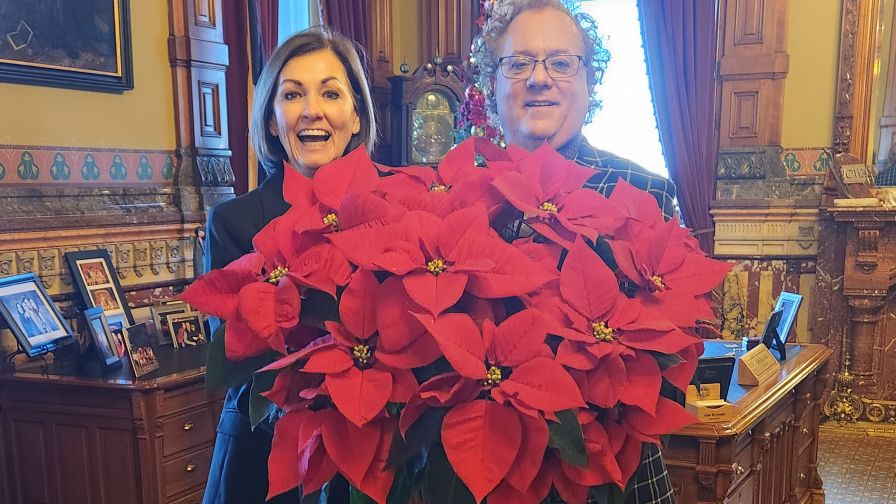 Gov Kim Reynolds w Mike Gooder Poinsettia Presentation 2023 Web