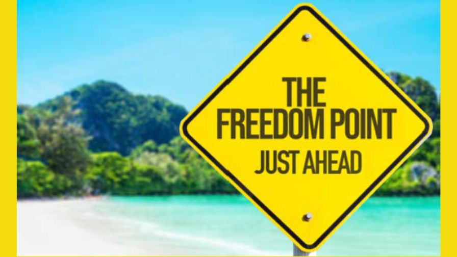 Graphic from PivotPoint Business Solutions, featuring a yellow traffic sign on a beach with print "The Freedom Point Just Ahead."