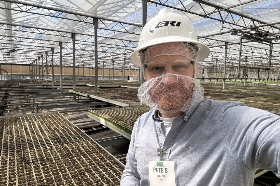 A visitor to an ERI energy monitoring facility, paired with Microclimates hardware.
