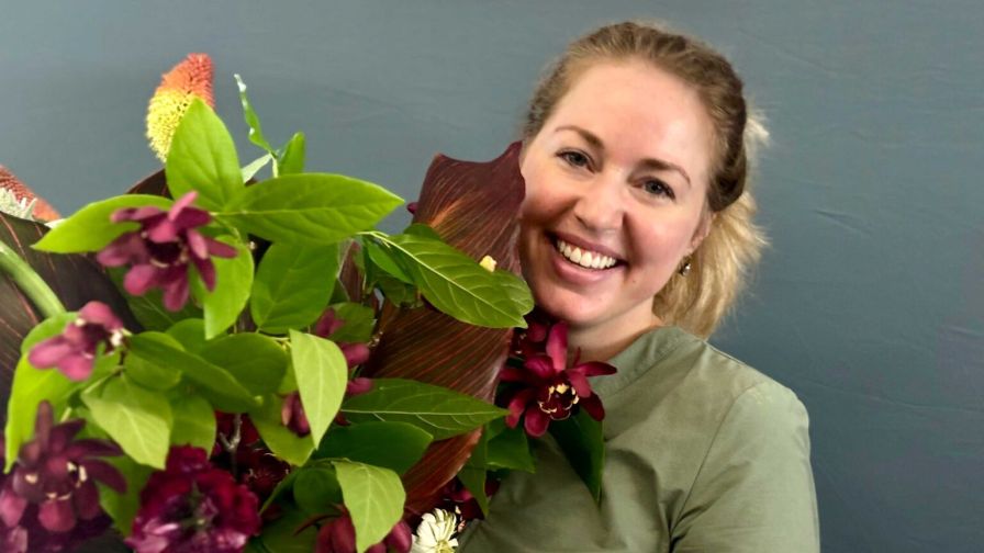 Amanda Solliday holding sustainable flowers arranged for the Department of Horticultural Science 2025 spring graduation commencement. For sustainability article.