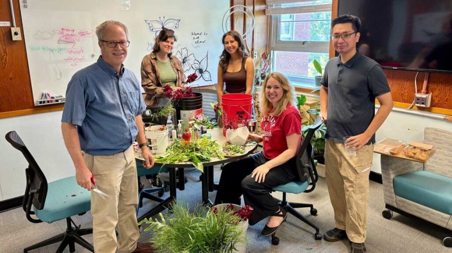 Professor John Dole and students Emma Coogan, Ivy Azzarita, Amanda Solliday and Rick Shih arrange flowers for the horticultural science 2025 spring graduation.