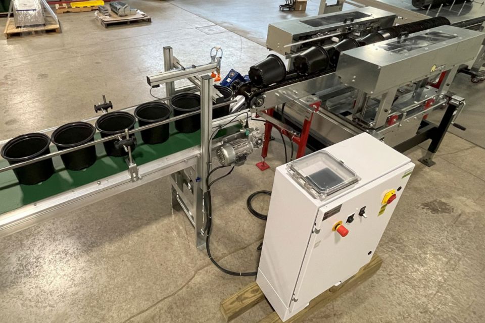 The CD-X1 Nursery Pot Dispenser from AdeptAg offers a fast, reliable solution for automating pot loading on the production line. Designed for pots 6.5 to 15 inches in diameter, the system mechanically separates and advances them via chain conveyor, tipping each upright onto an inline belt, ready for filling.