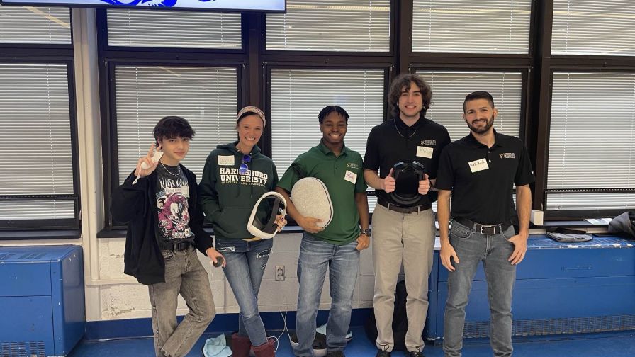 Dr. Jen Mowery (second from left) and Professor Matthew Rissler (first from right) with students at the Future Cities competition.