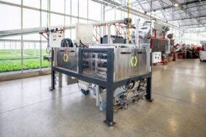 The Pot-in-Tray Machine provides the high-speed automation of loading pots into trays with an output of 15 trays per minute.