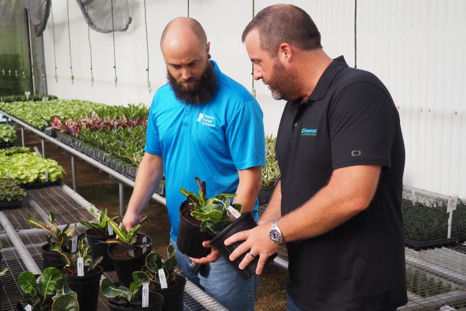 Chris Rocheleau (L) and Joseph C. Roberts IX (R) evaluate a new introduction in Foremost’s Codiaeum Thai Dye Series.