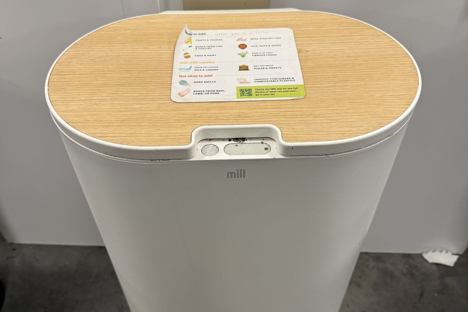 An electric food mill helps process organic waste for composting.