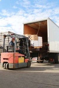 Second generation David Hull driving a forklift at the loading dock