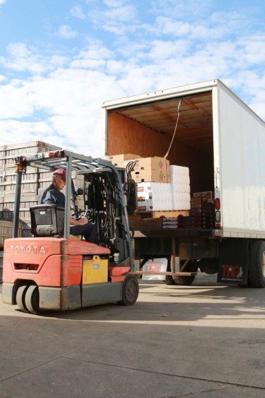 Second generation David Hull driving a forklift at the loading dock