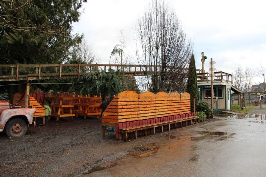 An outdoor sales area is tucked under the goat bridge.