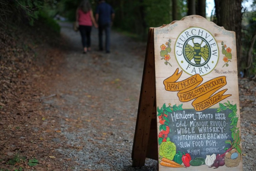 This sign touts the farm dinner partners and host
