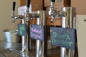 A hard cider station is along side the bakery sales displays.