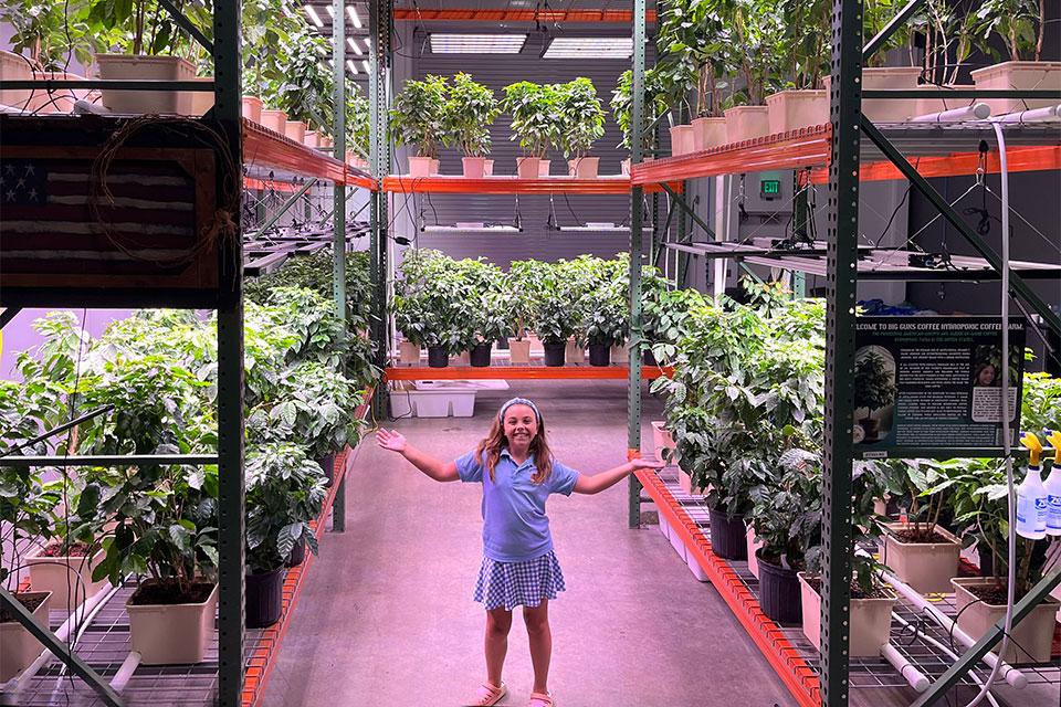 Charli Johnson in Big Guns Coffee greenhouse