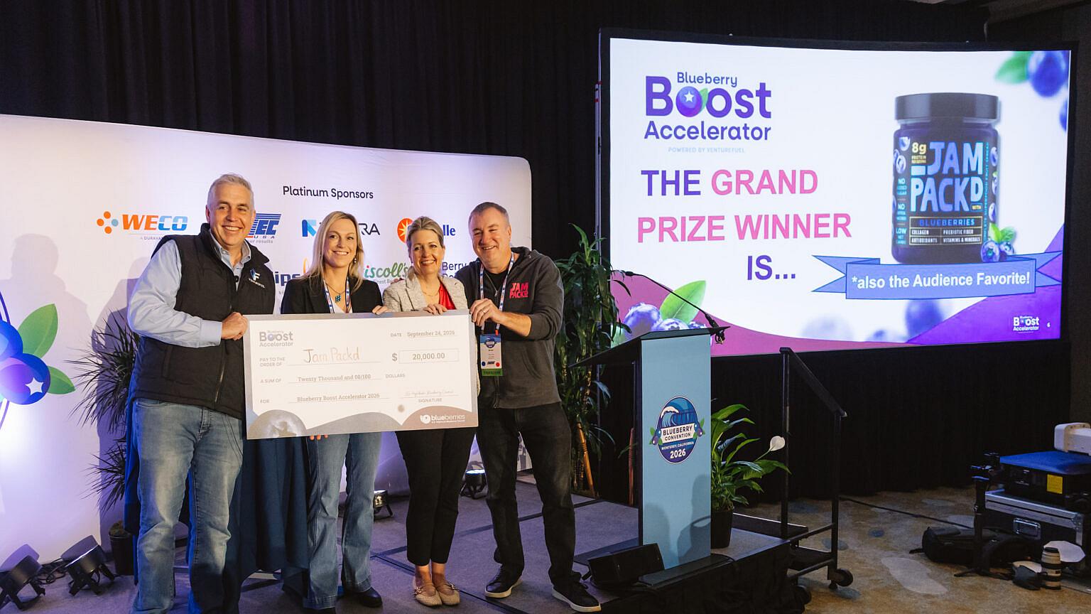 Michelle and Brian Platt of Jam Packd are presented a grand prize check for winning the 2026 Blueberry Boost Accelerator competition.