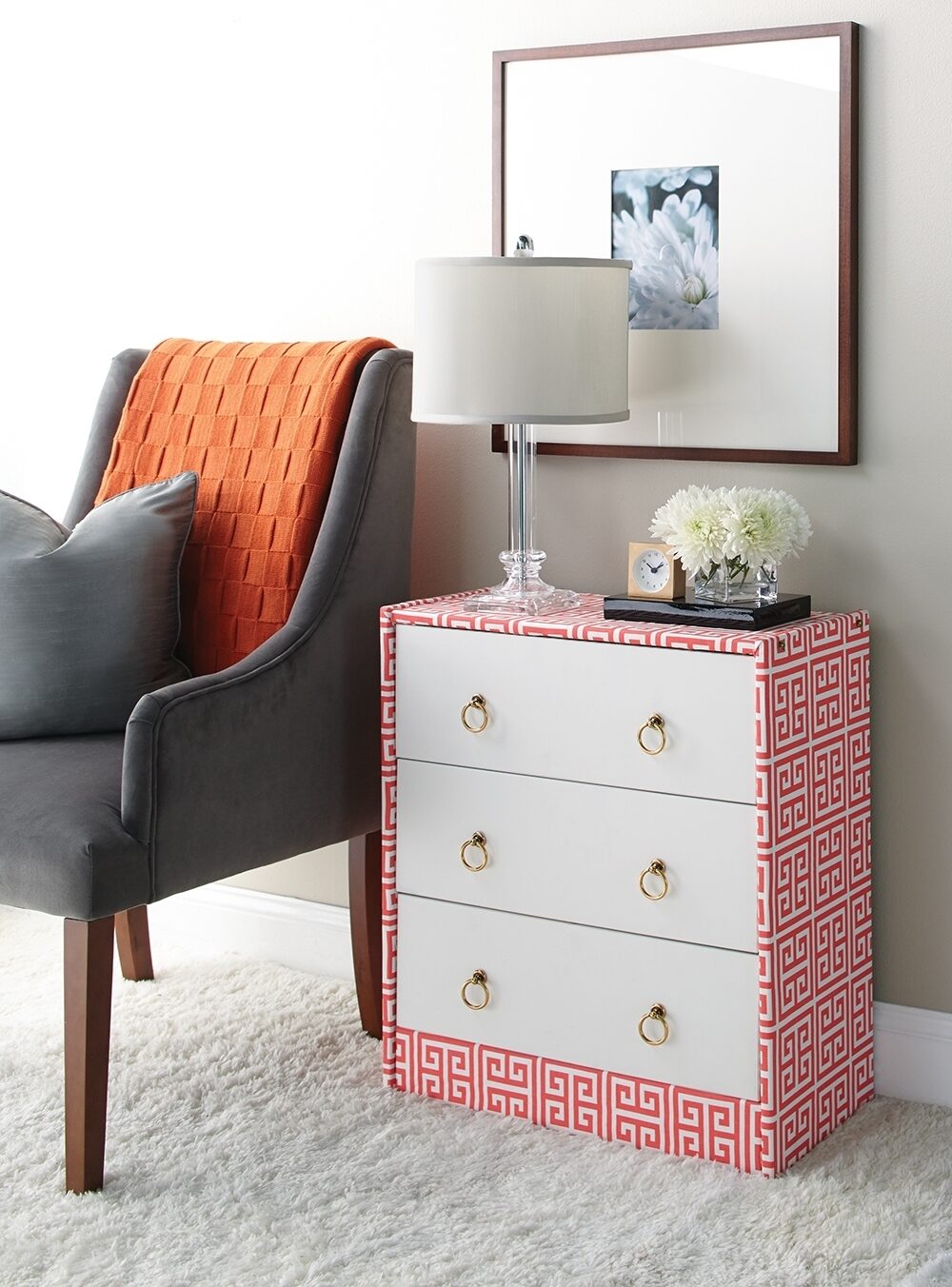 Starting with a very basic dress, we gave it a splash of color with a trendy fabric. Drawer fronts were painted and brass ring pulls installed. Cost was under $80, including the dresser, and all was completed in an afternoon.