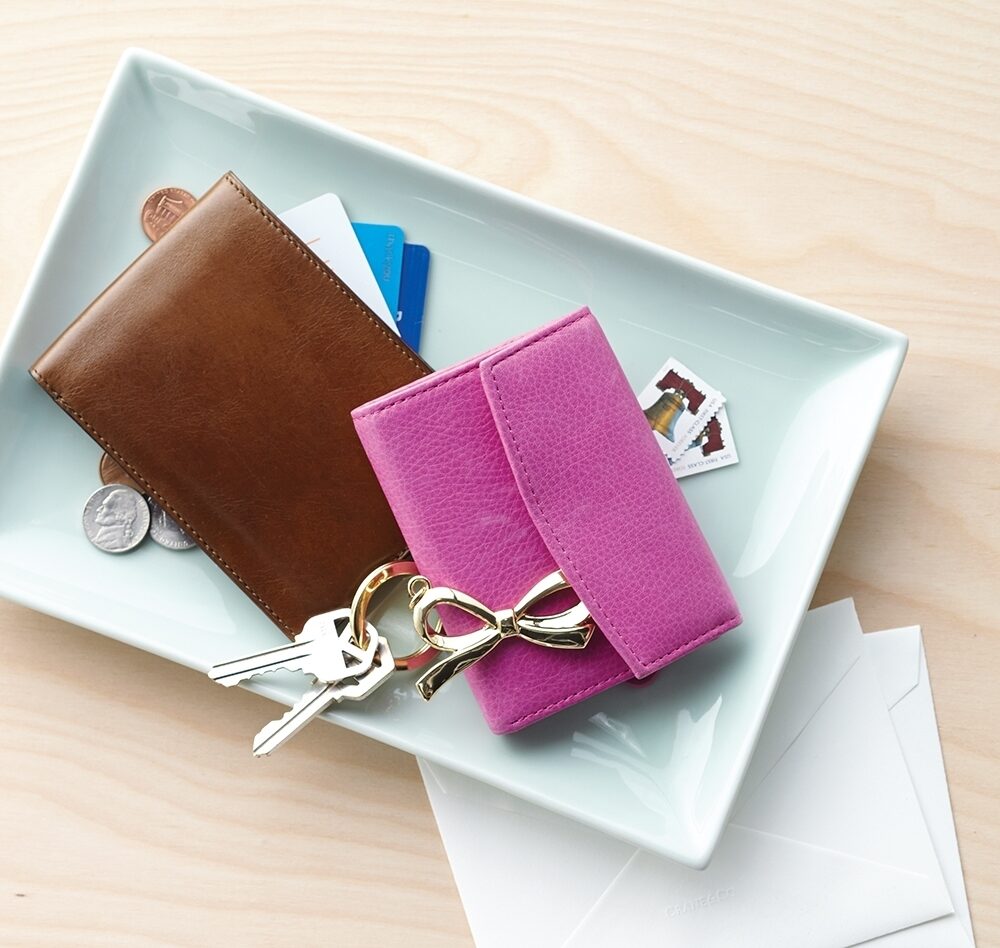 Wallets, keys, and change are collected on a catch-all plate
