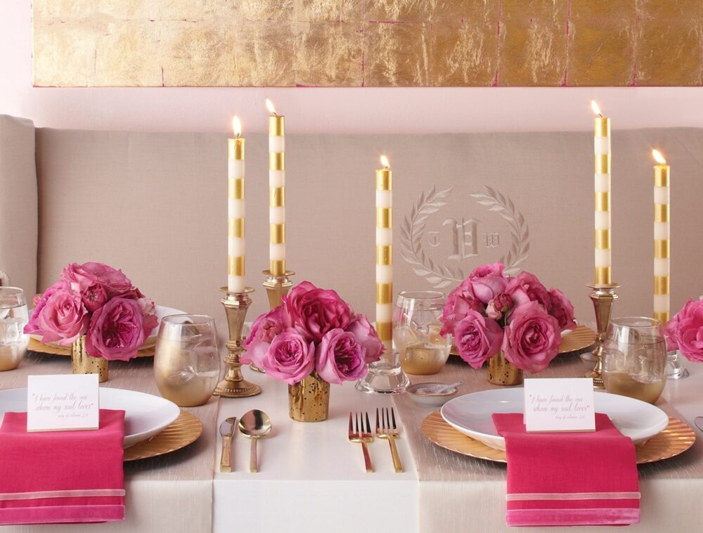 This table setting begs guests to relax and be pampered. Lush pink garden roses, glittering gold accents and luxurious ribbon-trimmed napkins set an elegant tone.