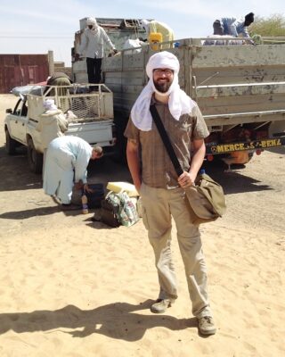 Here I am with my camera bag slung over my shoulder about to climb aboard a truck headed deep into the desert in Chad. As a photographer for Horizons Magazine, I was headed out to capture images of missionaries delivering supplies for a new school building. There was no room in the cab, so I rode in back, jostled on top of the supplies. Now I know how practical turbans are in the sun-scorched desert.