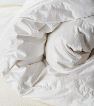 The best comforters are premium goose down sterilized to be hypoallergenic or a high-quality synthetic.