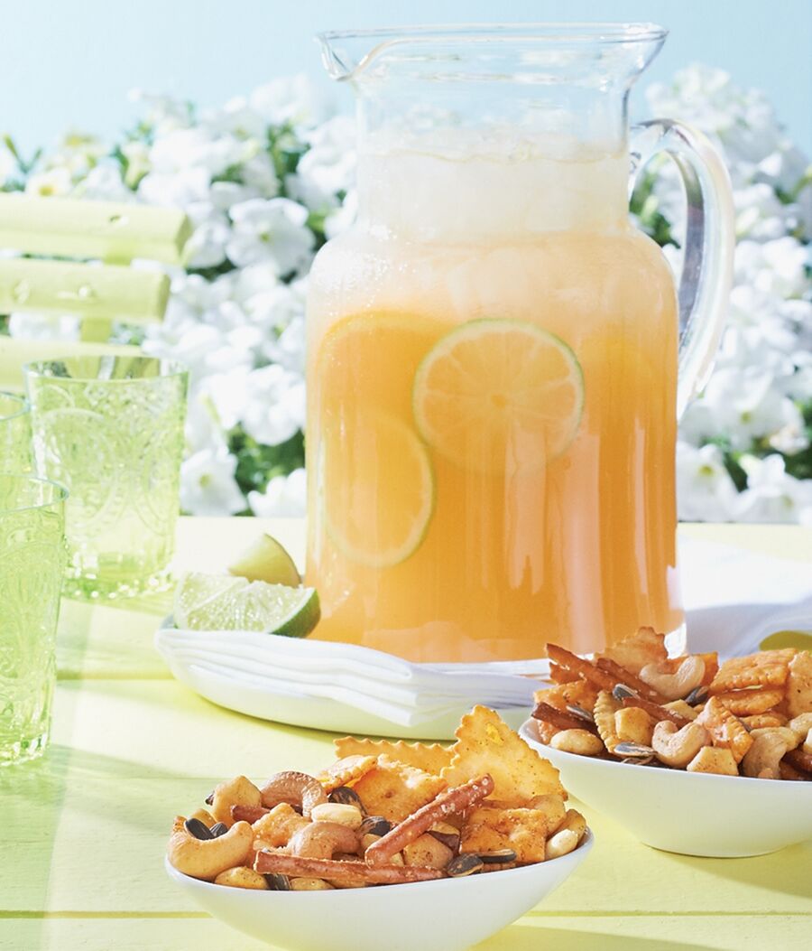 Bowls of Smoky Snax are served with a pitcher of Mango-Orange Seltzer