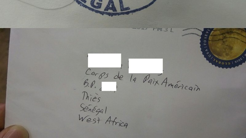 White envelope with Volunteer's address in Senegal written on it.